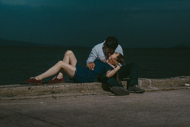 Couple holding each other in the dark