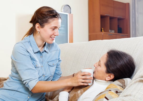 daughter taking care of sick mother