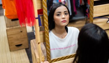 woman staring in mirror