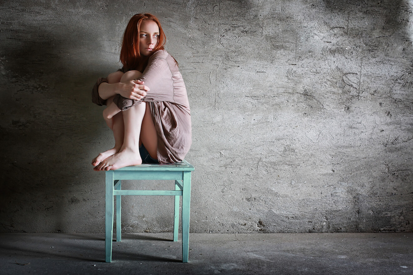 Woman on stand with grey background