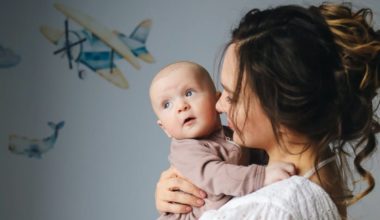 mother holding newborn child