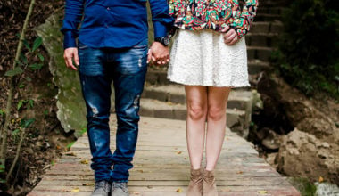 man and woman standing on dock facing toward camera