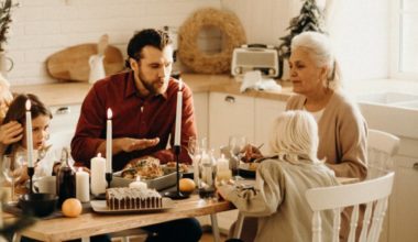 family sitting at dinner together looking slightly tense