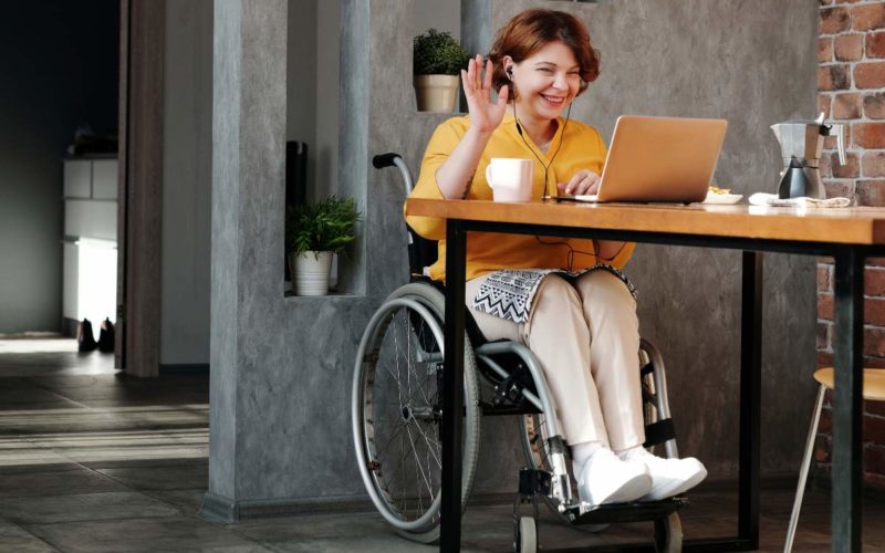 lady in a wheelchair participating in a video conference