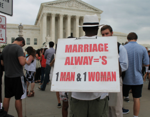 man with marriage sign