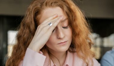 woman with head down looking stressed