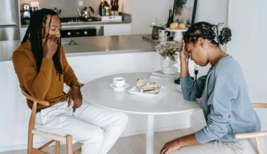 man and woman sitting at table and not eating