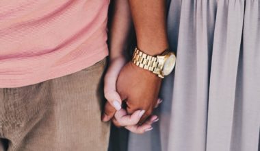 couple holding hands and standing together closely