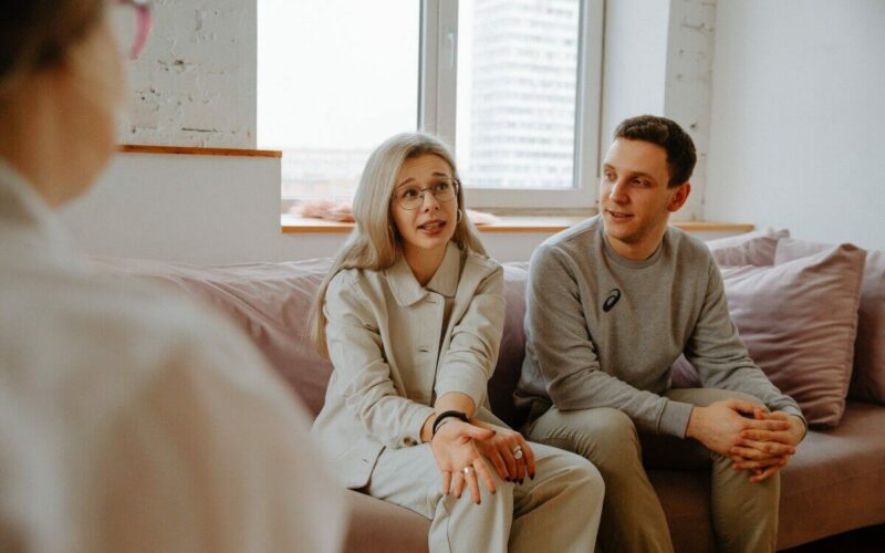 couple sitting on sofa