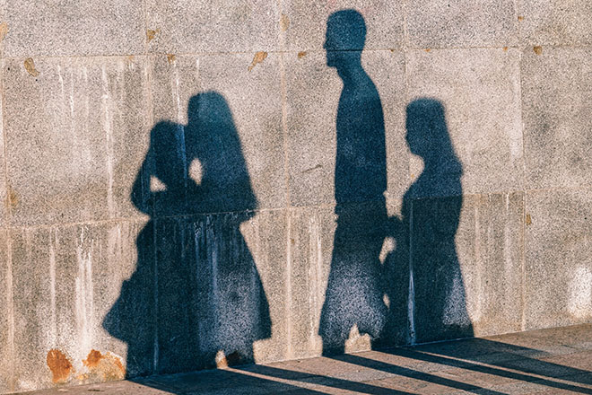 Shadow of Family Projected onto a Wall