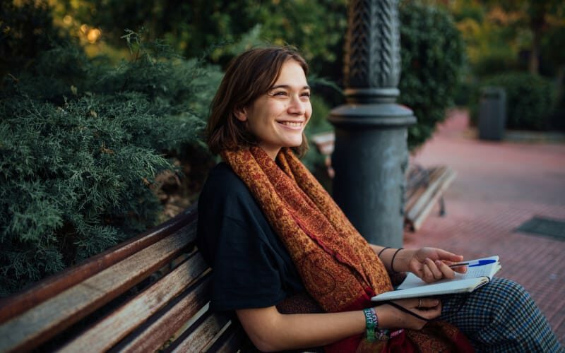 young-woman-sitting-on-bench