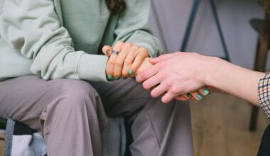 person holding woman's hands