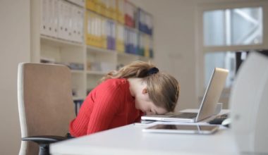 girl with head on desk and giving up