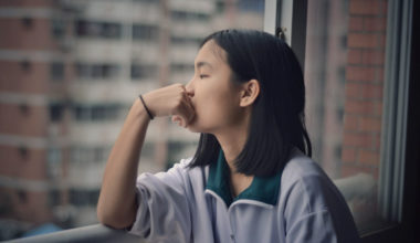 girl practicing introspection by window