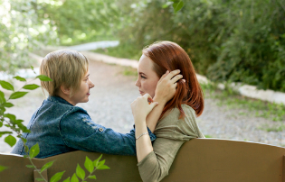 lesbian couple park bench