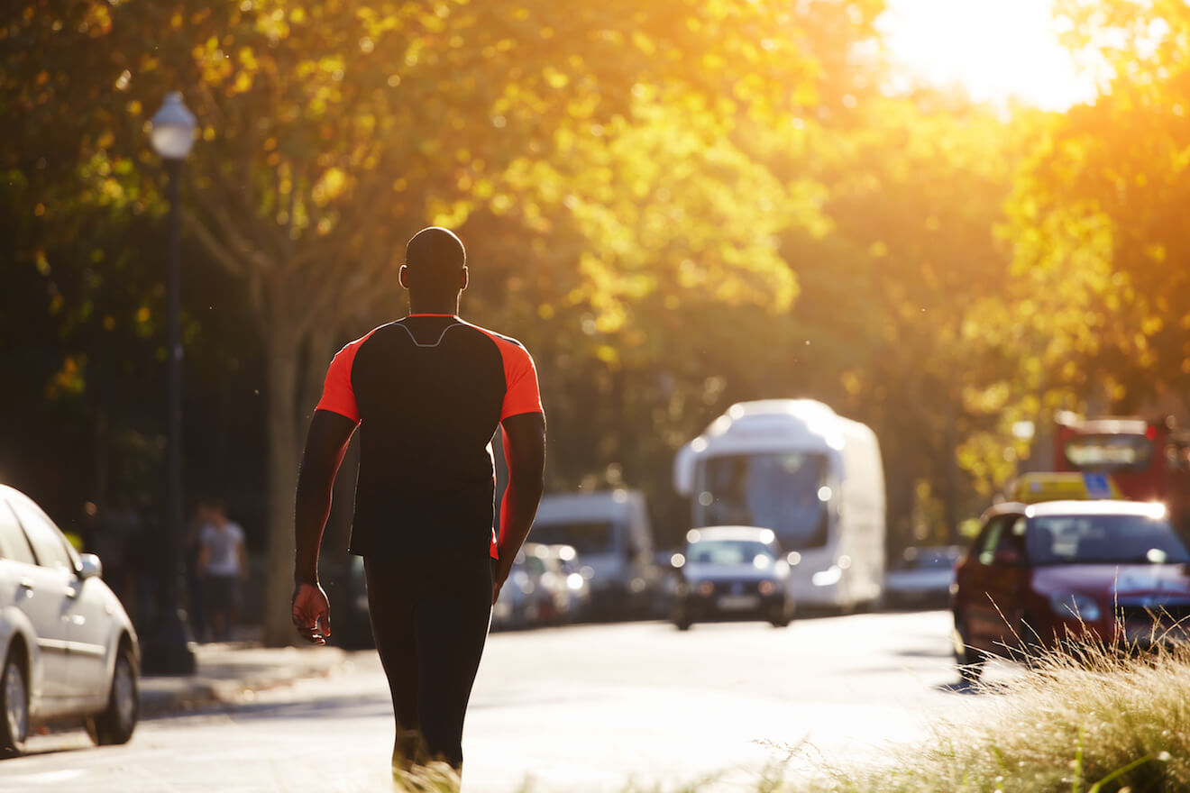 Athletic man resting after a run outside