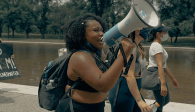 black woman with megaphone black history month