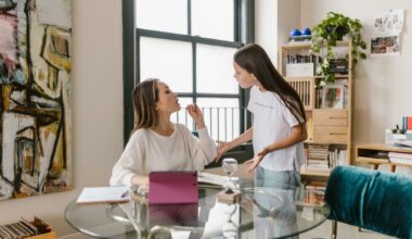 mother sitting at table fighting with daughter