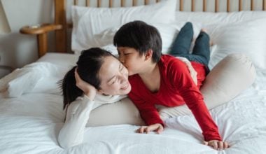 mother and son on bed