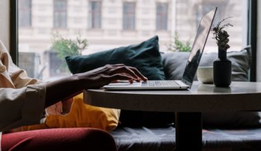 person typing on laptop