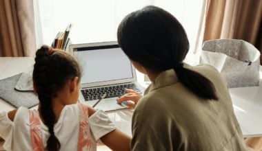 Mother going over schoolwork with her child