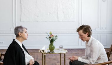 man speaking to woman