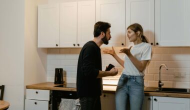 man and woman fighting in kitchen