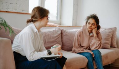 female psychiatrist speaking to client on coach