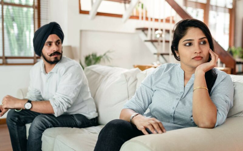 woman sitting and ignoring male partner