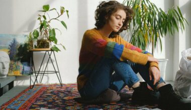 woman sitting on carpet looking to the side