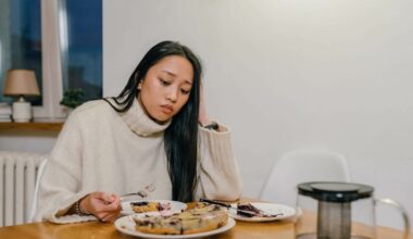 sad woman eating and looking into space