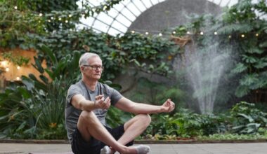 man sitting in garden meditating