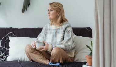 woman sitting on couch looking to side