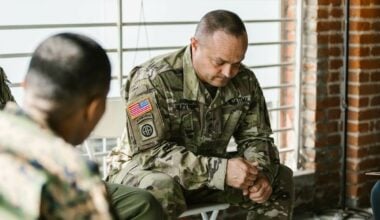 veteran sitting alone looking down