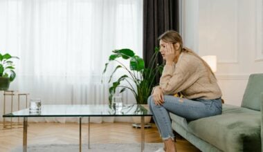 stressed out woman sitting on couch