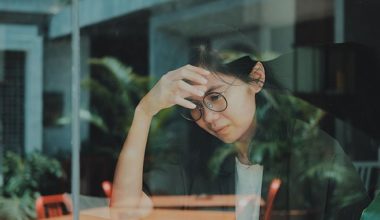 Stressed woman in cafe