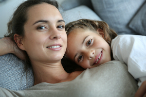 mom daughter smiling couch