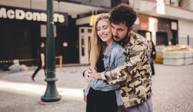 young guy hugging young girl