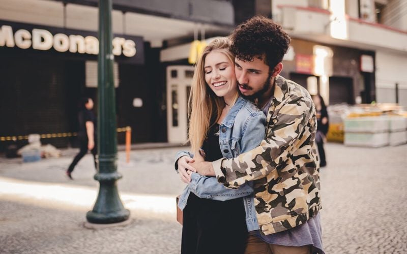 young guy hugging young girl