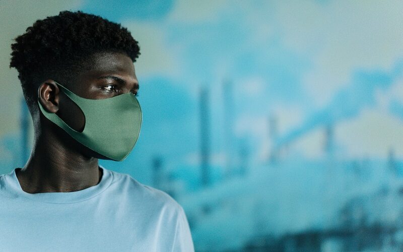 Young man with protective mask on his face