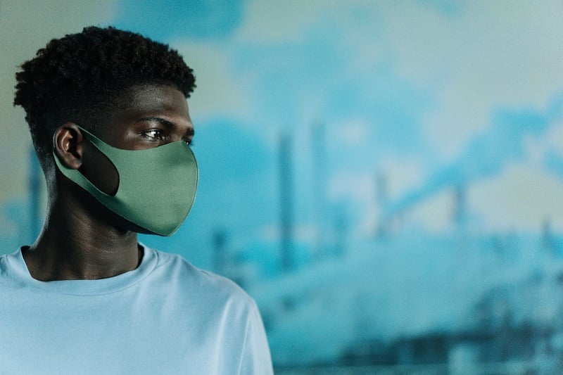 Young man with protective mask on his face