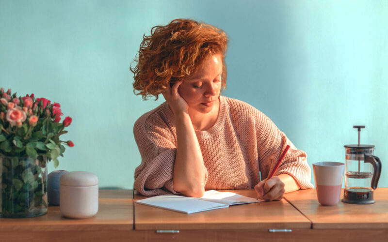 woman-writing-at-desk