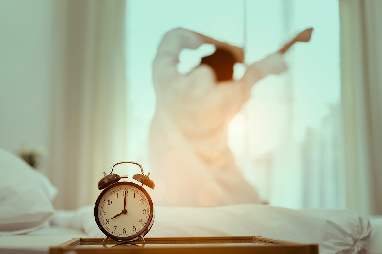 Woman with alarm clock