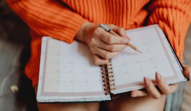 woman writing in a planner