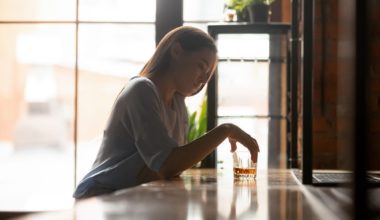 woman holding a drink