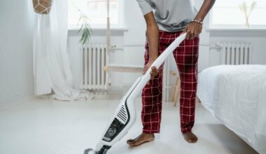 Man vacuuming carpet