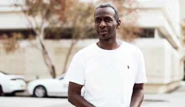 black man standing on the street