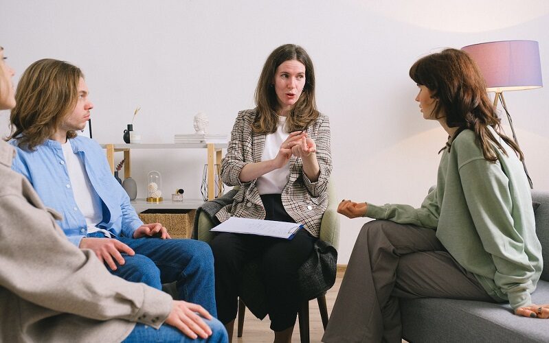 Therapist and group of patients in milieu therapy