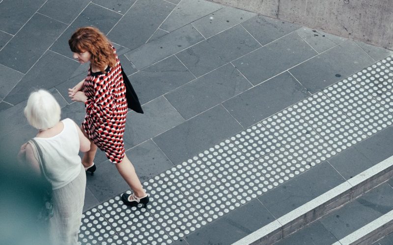 two women walking and talking