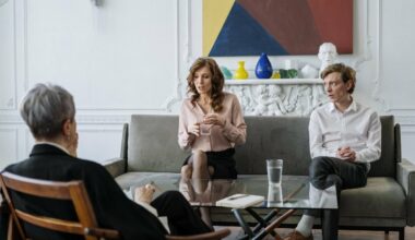 couple sitting on couch across from therapist